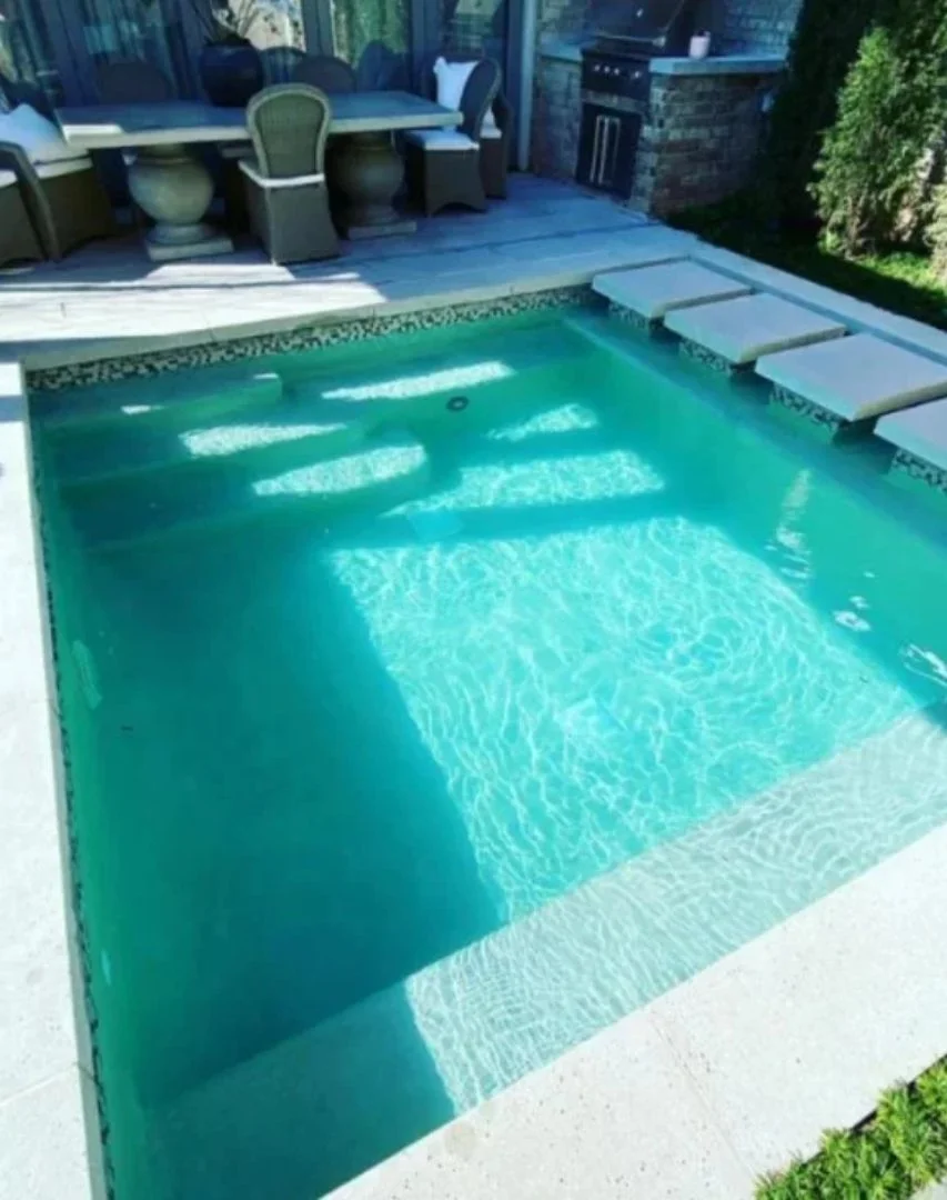 Pool With A Table And Chairs